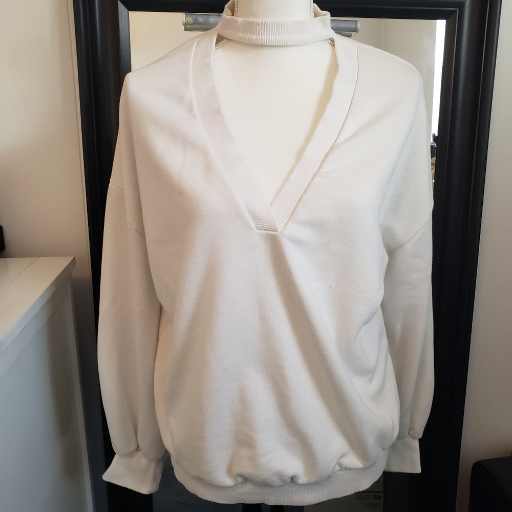 Lush white sweatshirt with peekaboo neckline